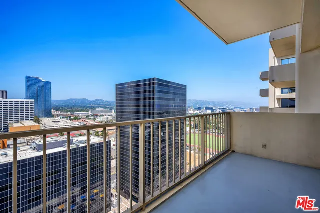 a view of a balcony with city view