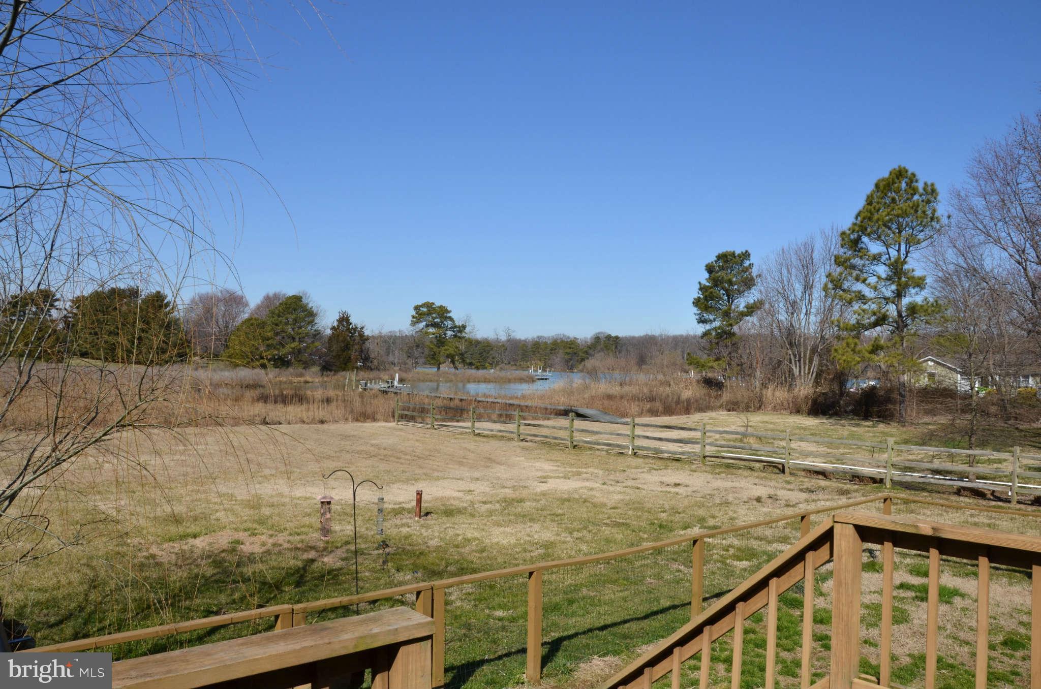 103 Parks Road Chester, MD 21619 - Photo 2 of 25 a view of a lake with a big yard