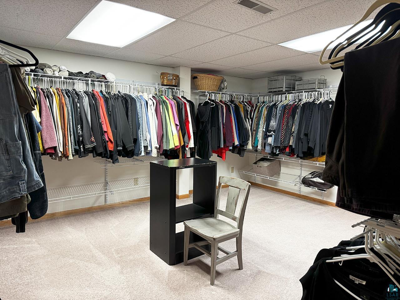 197 Jefferson Street Buhl, MN 55713 - Photo 19 of 31 Spacious closet with a paneled ceiling and carpet flooring