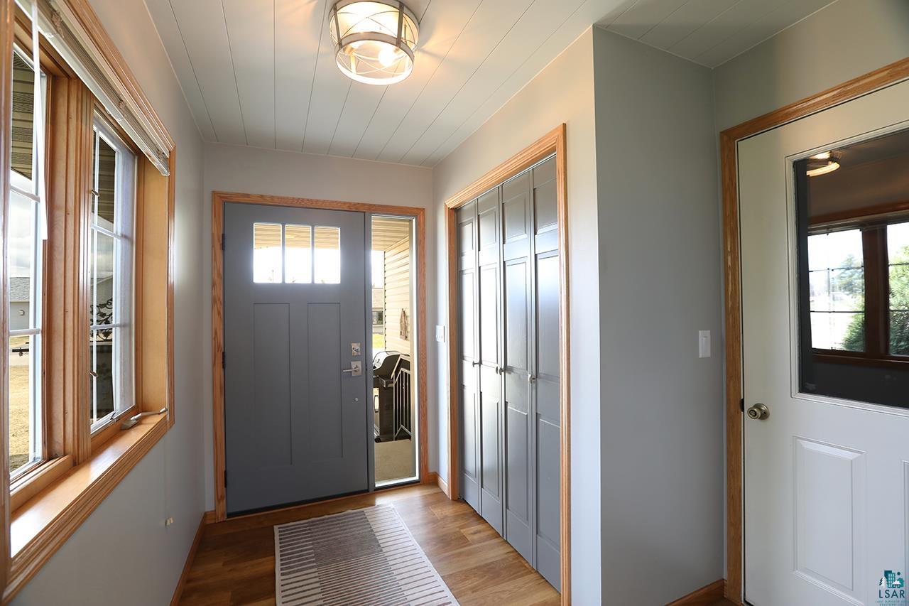 197 Jefferson Street Buhl, MN 55713 - Photo 24 of 31 Entryway featuring light wood-type flooring and baseboards