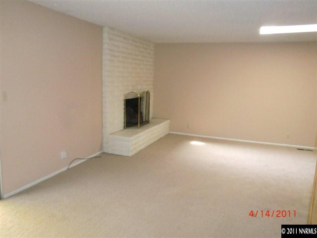 2015 Windsor Way Reno, NV 89503 - Photo 3 of 8 an empty room with a fireplace