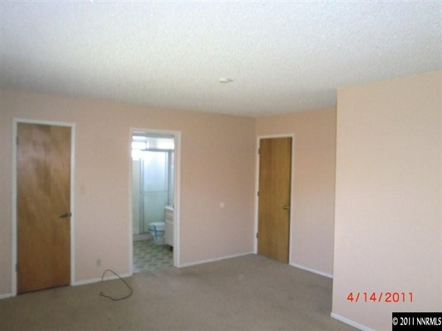 2015 Windsor Way Reno, NV 89503 - Photo 6 of 8 an empty room with closet and mirror