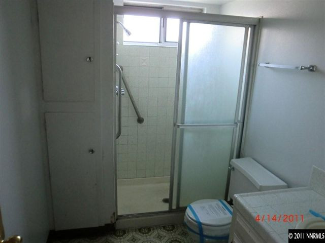 2015 Windsor Way Reno, NV 89503 - Photo 7 of 8 a bathroom with a toilet and a shower