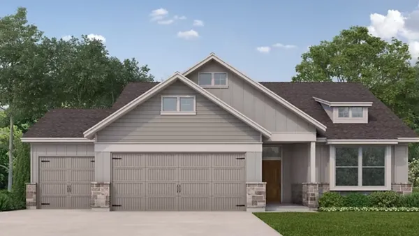 a front view of a house with garage