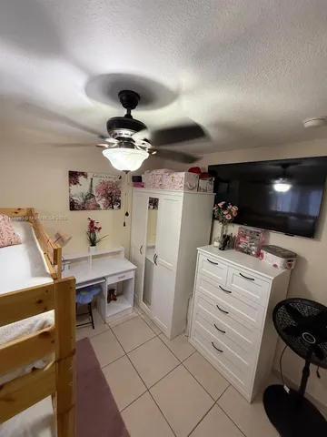 a room with furniture a chandelier and a window