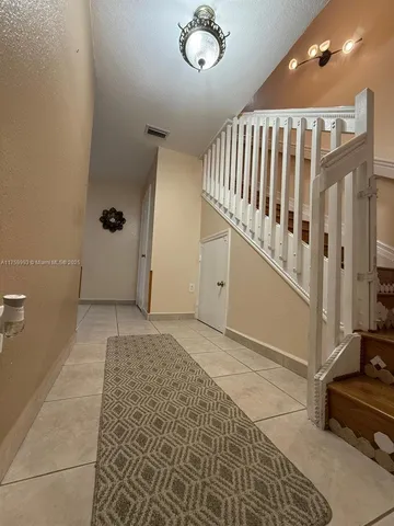 a view of an entryway with a workspace