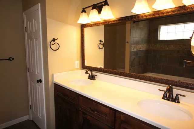 a bathroom with a sink and a mirror