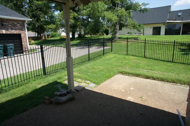 a view of a house with a back yard