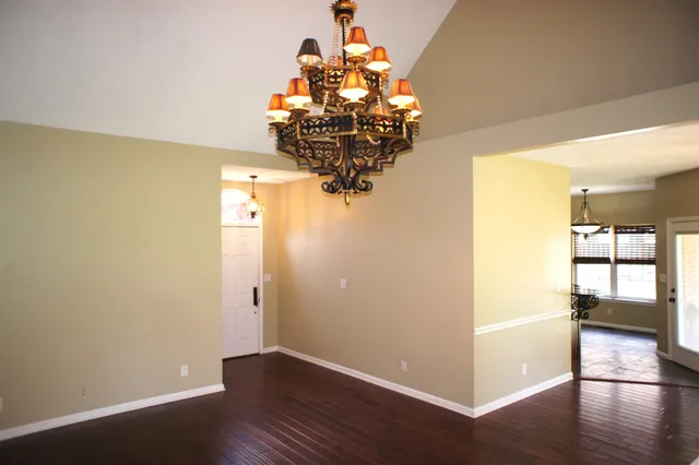 a view of a dining room with wooden floor