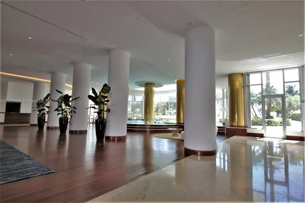 a view of dining room with furniture and wooden floor