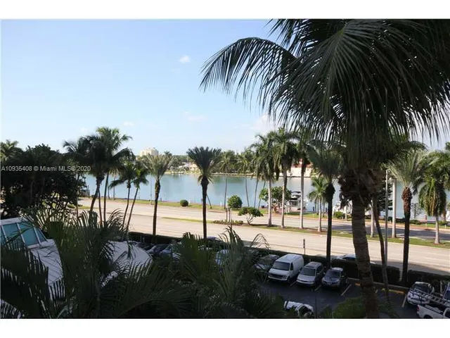 a view of outdoor space with palm trees