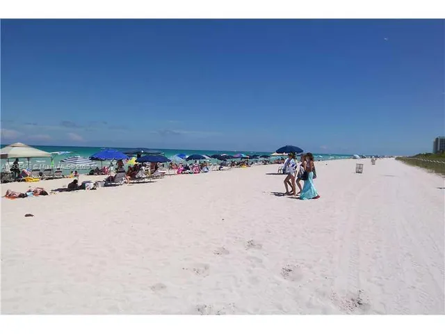 a view of a large building with a yard