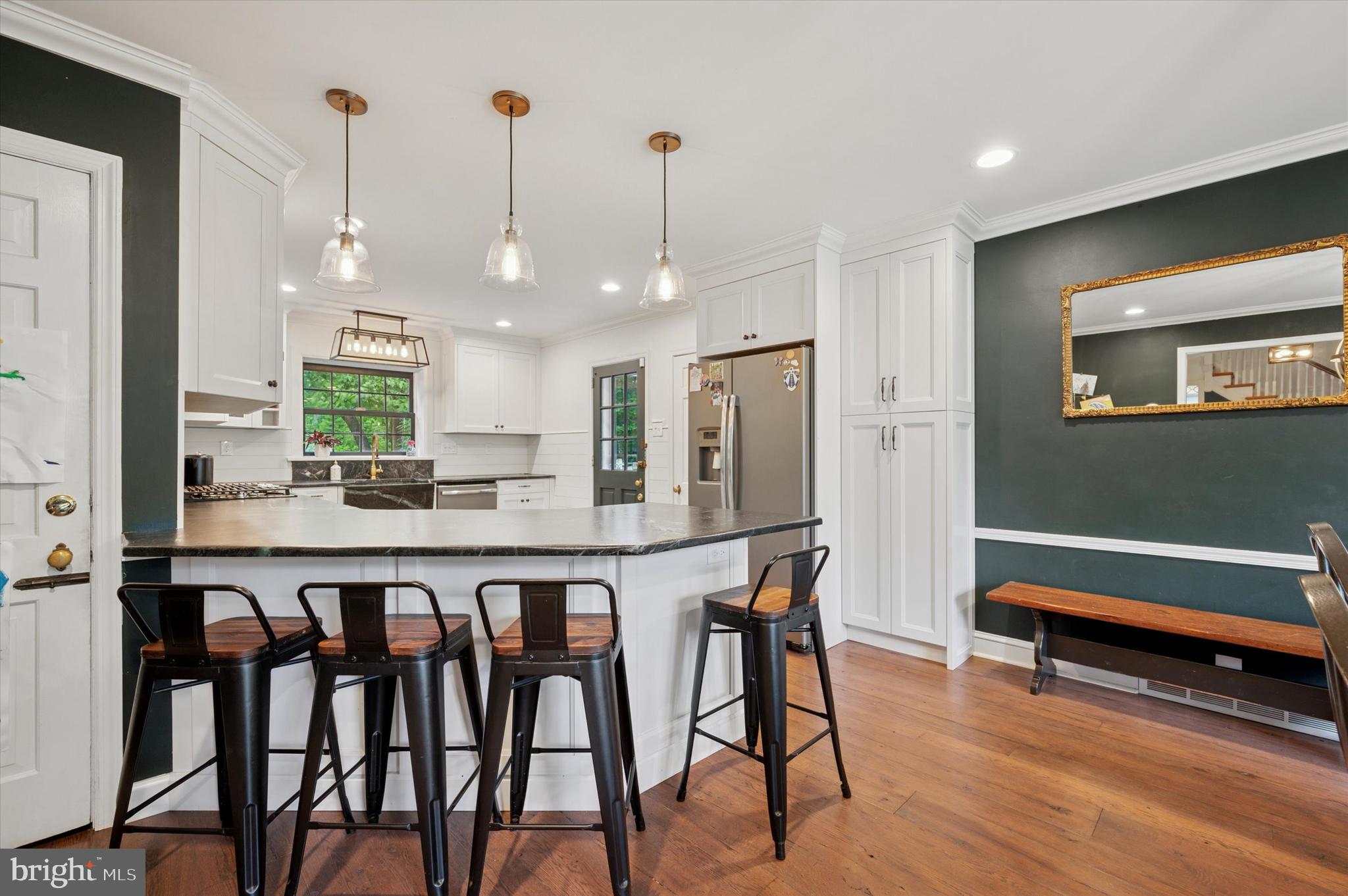 1205 Red Rambler Road Rydal, PA 19046 - Photo 16 of 34 a large kitchen with a table and chairs