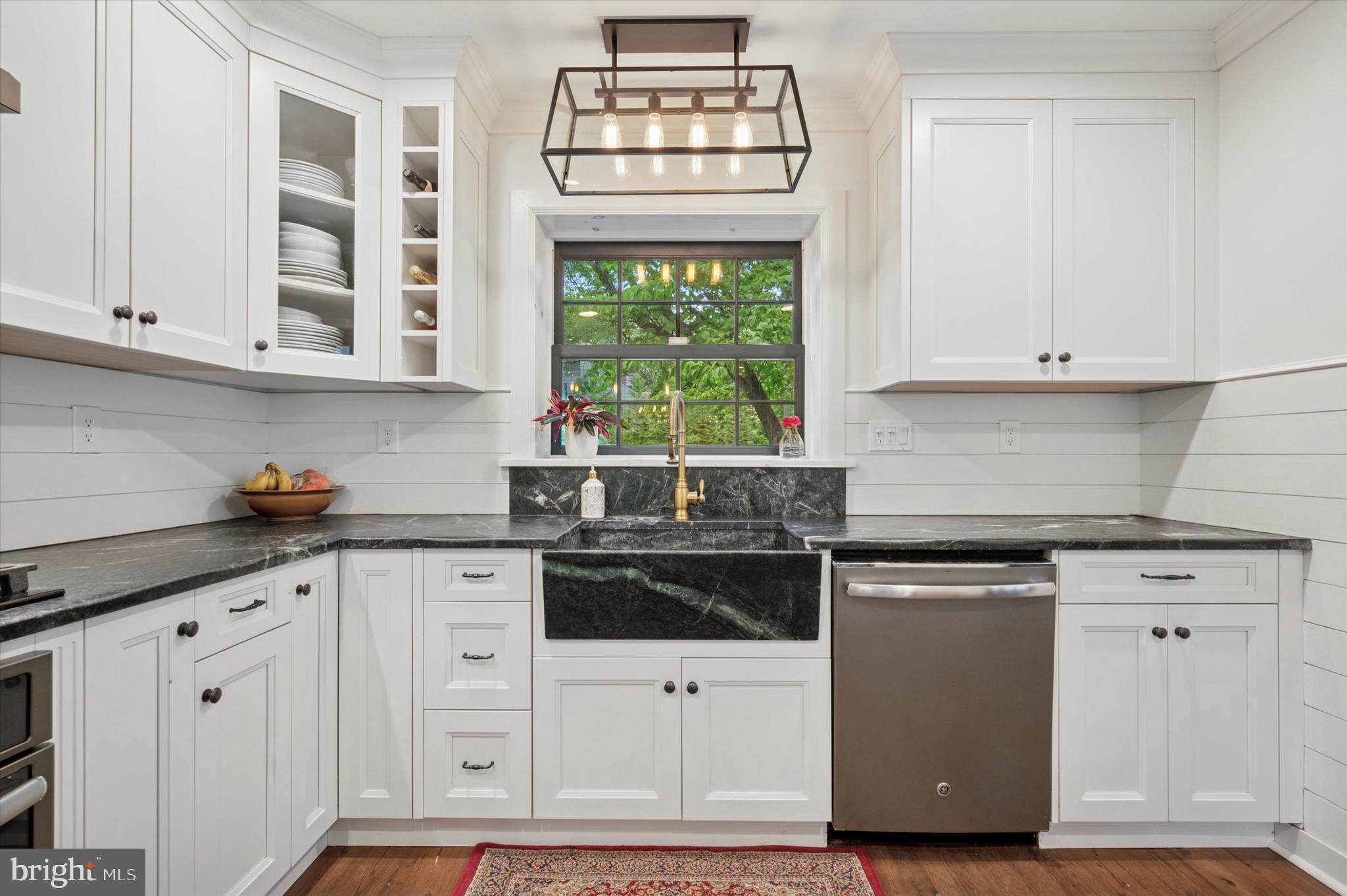 1205 Red Rambler Road Rydal, PA 19046 - Photo 19 of 34 a kitchen with white cabinets and window