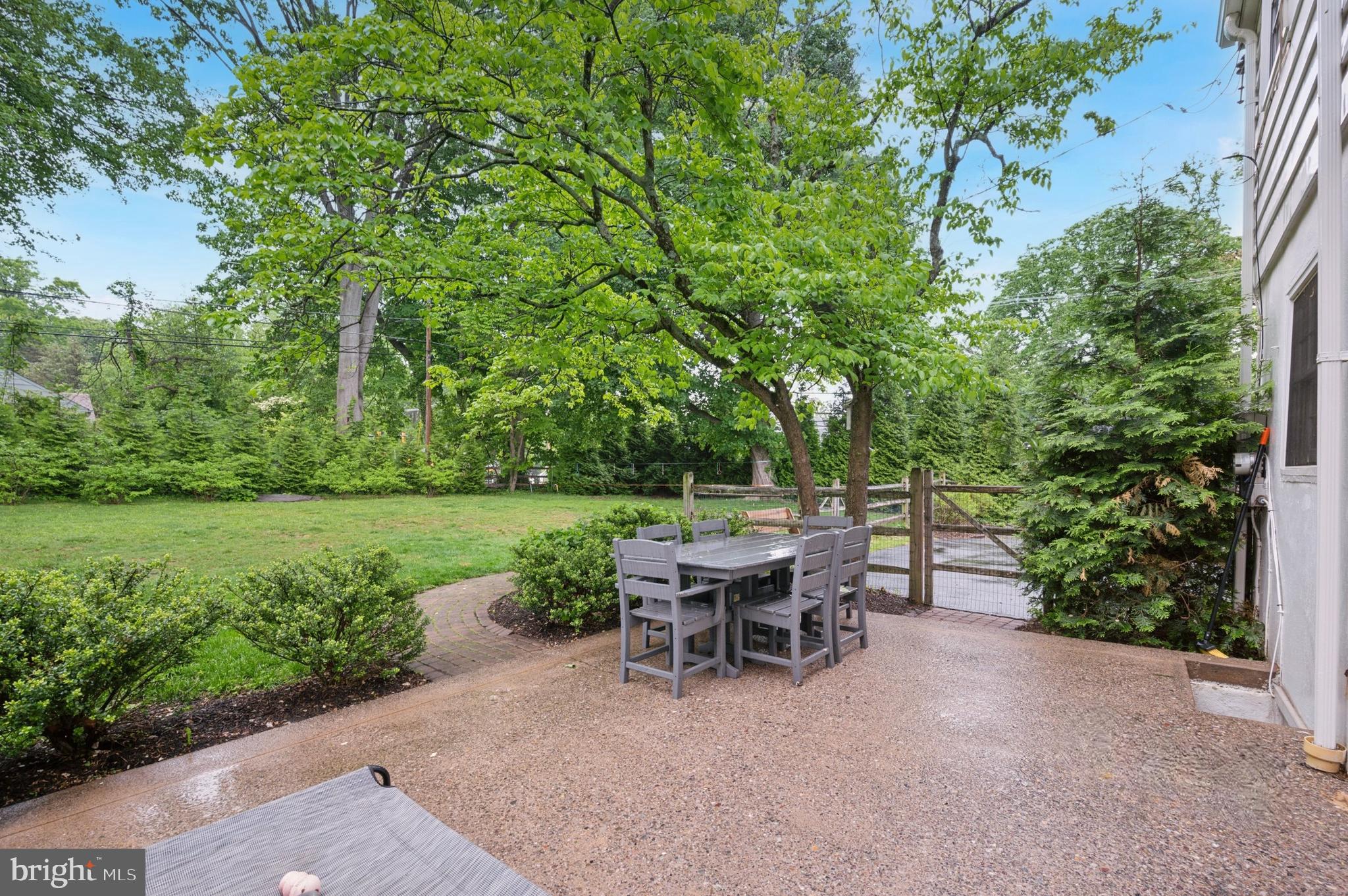 1205 Red Rambler Road Rydal, PA 19046 - Photo 6 of 34 a view of a dining table and chairs in the garden