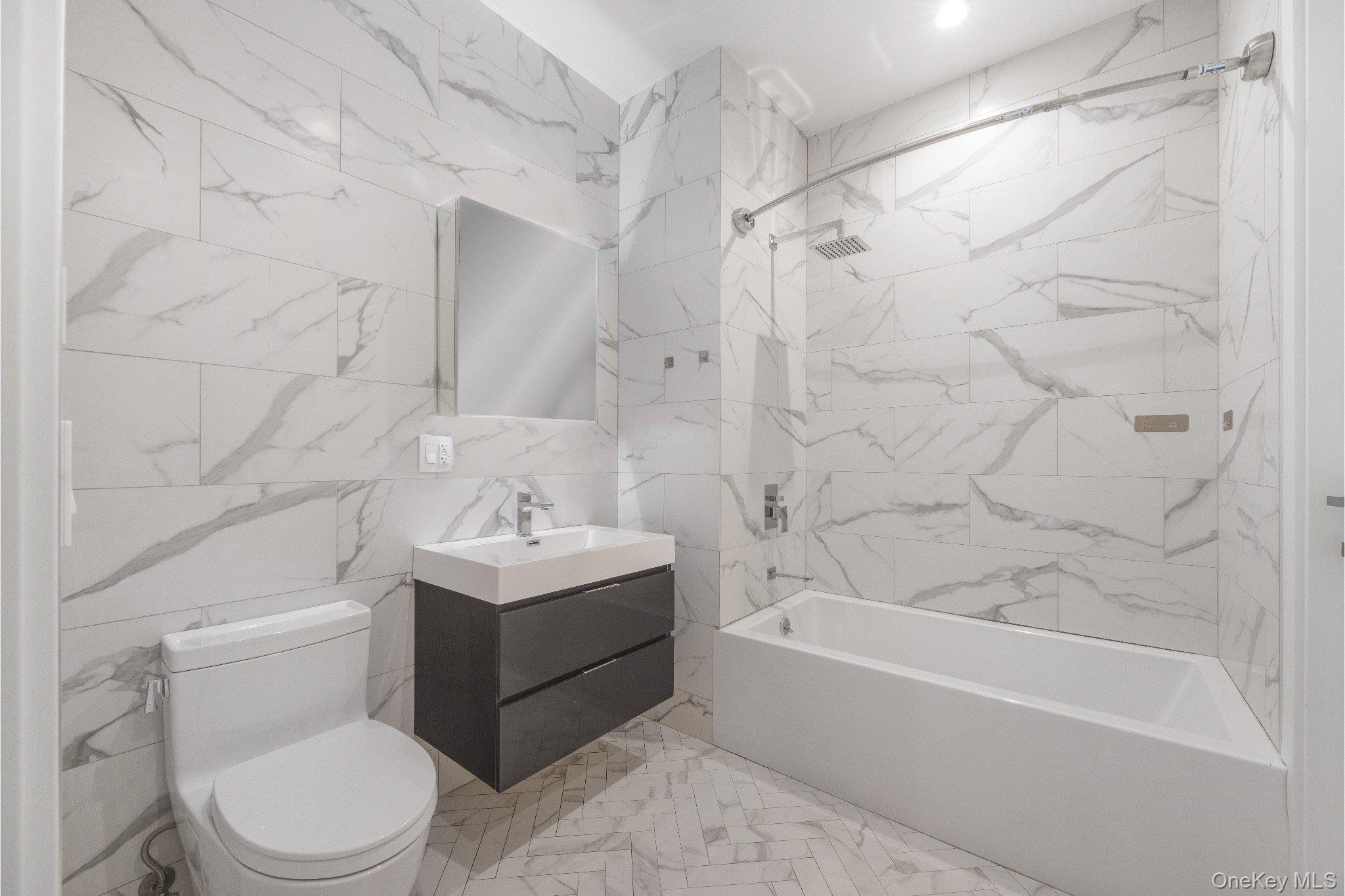 26-33 28th Street, Unit 3B Queens, NY 11102 - Photo 13 of 16 a bathroom with a sink toilet and shower