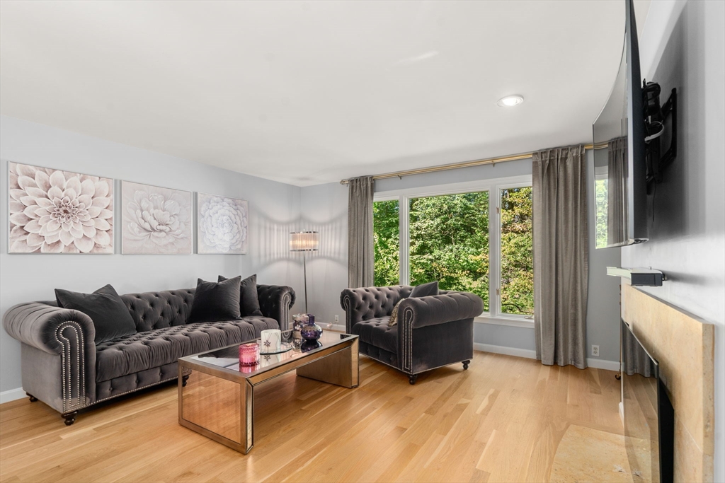 16 Coltsway, Unit 16 Wayland, MA 01778 - Photo 11 of 29 a living room with furniture and a flat screen tv