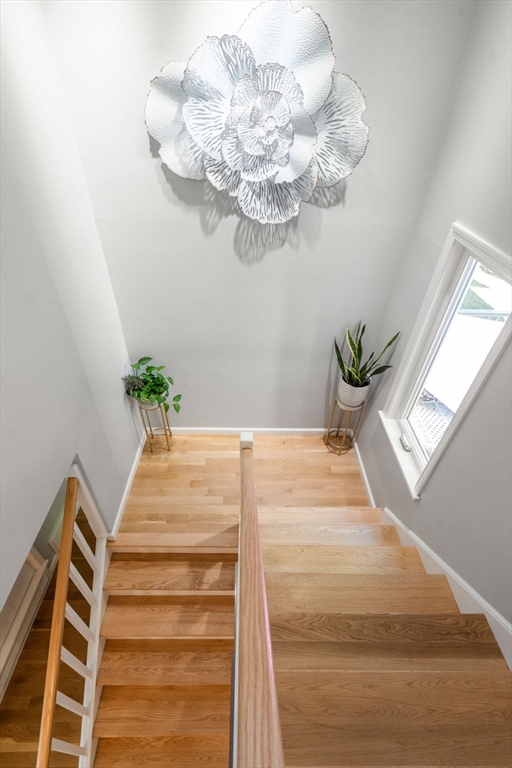 16 Coltsway, Unit 16 Wayland, MA 01778 - Photo 22 of 29 a view of hall with wooden floor