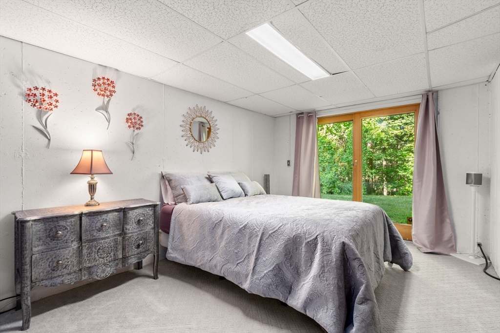 16 Coltsway, Unit 16 Wayland, MA 01778 - Photo 23 of 29 a bedroom with a bed dresser and window