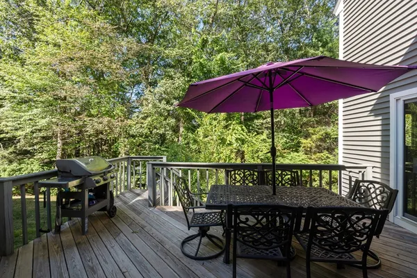 an outdoor space with furniture and umbrella