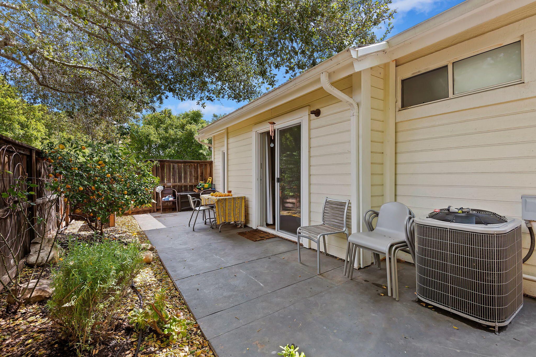 419 Barling Terrace Goleta, CA 93117 - Photo 14 of 17 a backyard of a house with barbeque oven table and chairs