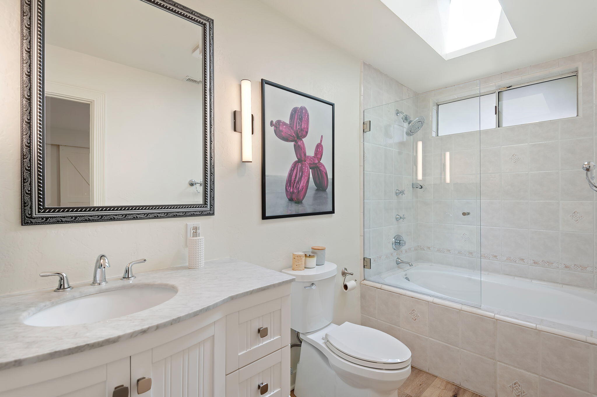419 Barling Terrace Goleta, CA 93117 - Photo 10 of 17 a bathroom with a granite countertop sink toilet and a bathtub