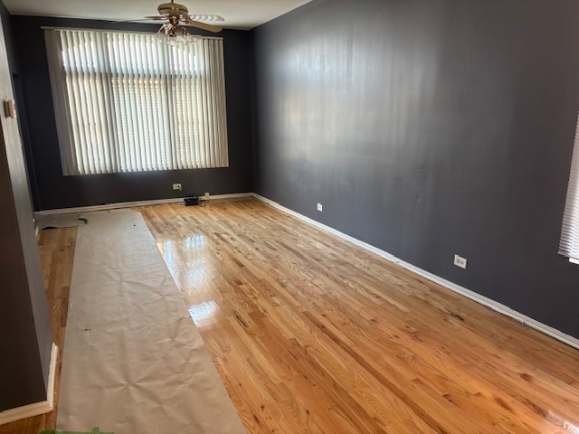 2825 West Lexington Street Chicago, IL 60612 - Photo 25 of 41 an empty room with wooden floor and windows