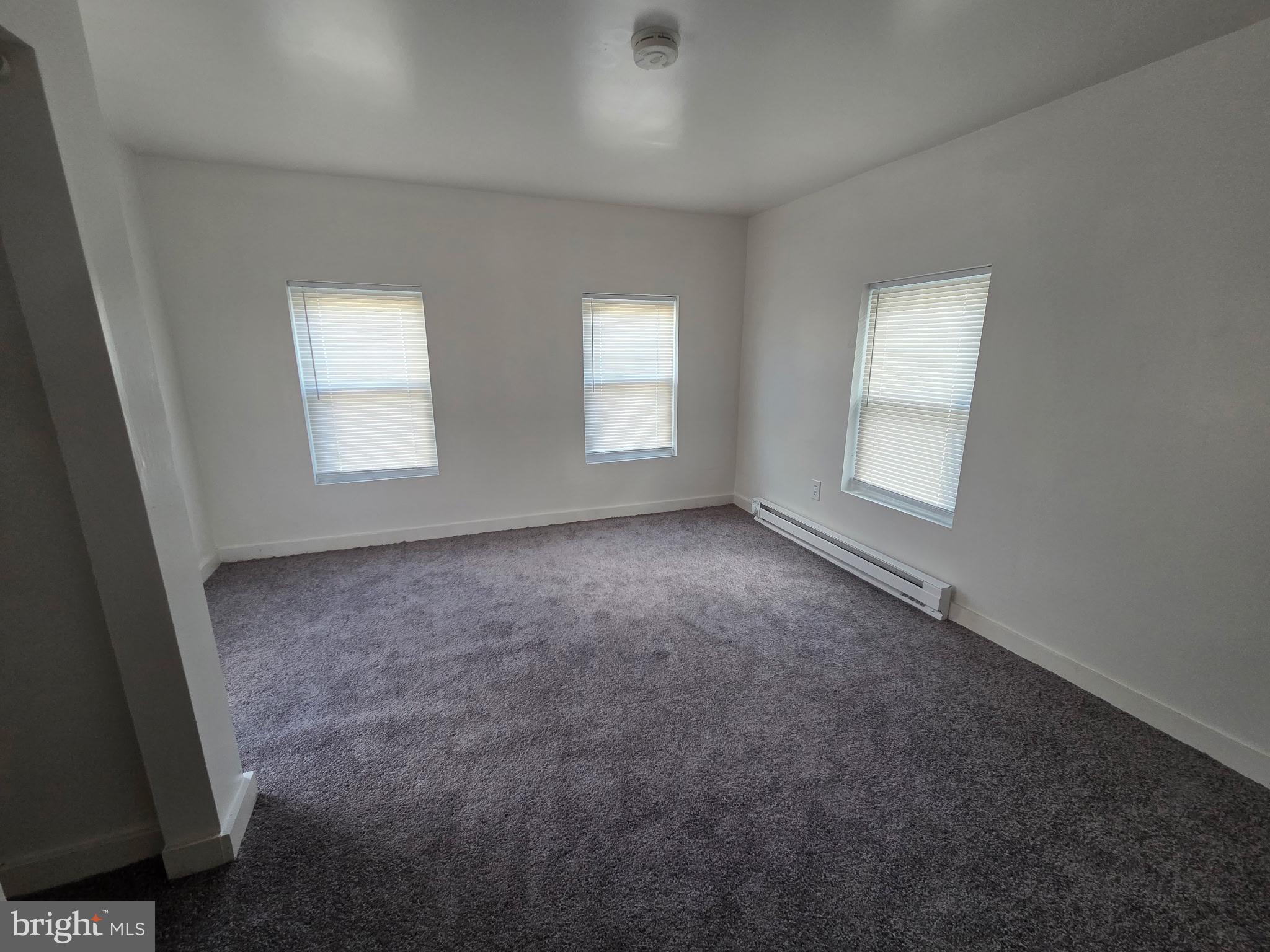 909 Pine Street Cambridge, MD 21613 - Photo 11 of 19 an empty room with windows