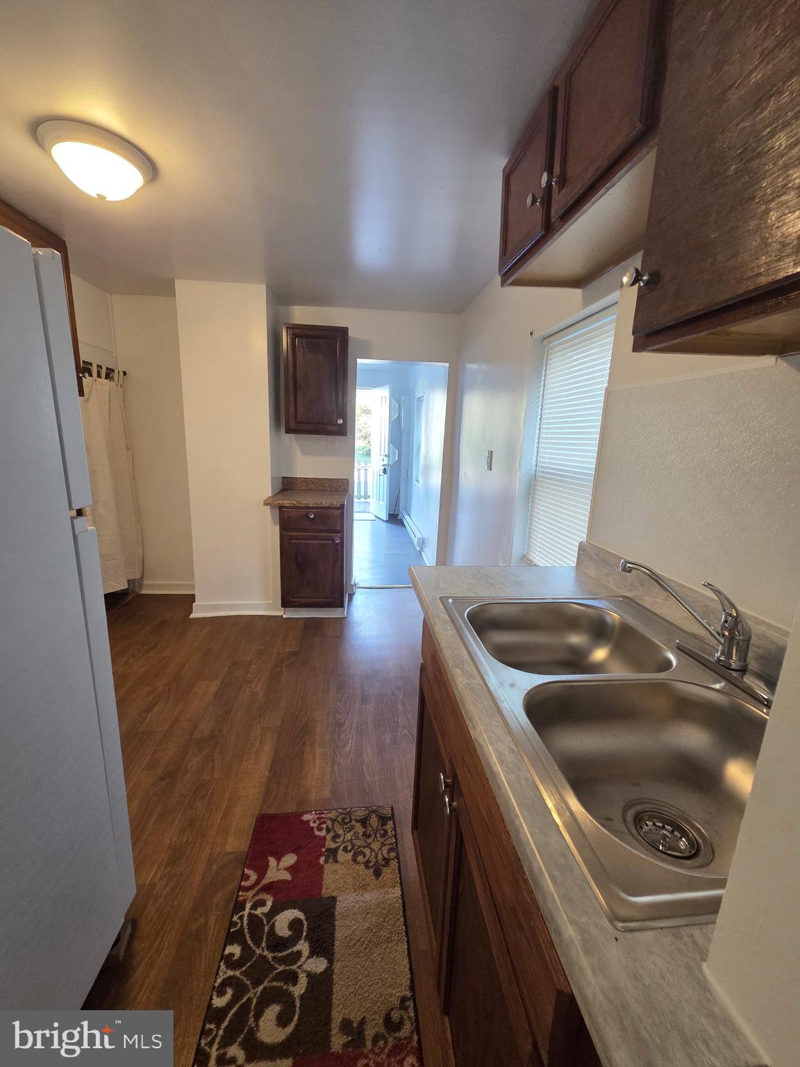 909 Pine Street Cambridge, MD 21613 - Photo 14 of 19 a kitchen that has a sink and a stove