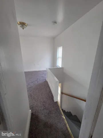 a view of a hallway view with staircase