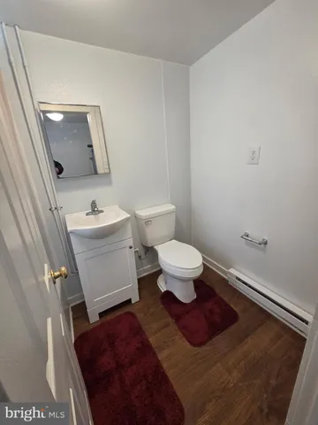 a bathroom with a toilet and a sink