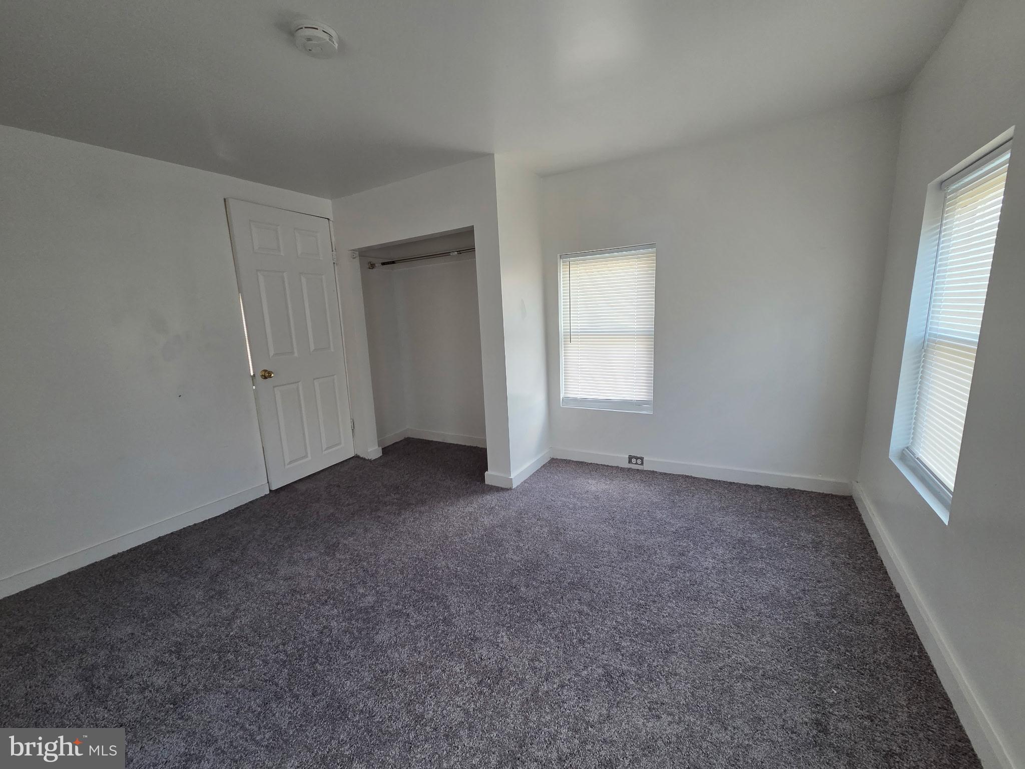 909 Pine Street Cambridge, MD 21613 - Photo 9 of 19 an empty room that has a window in it