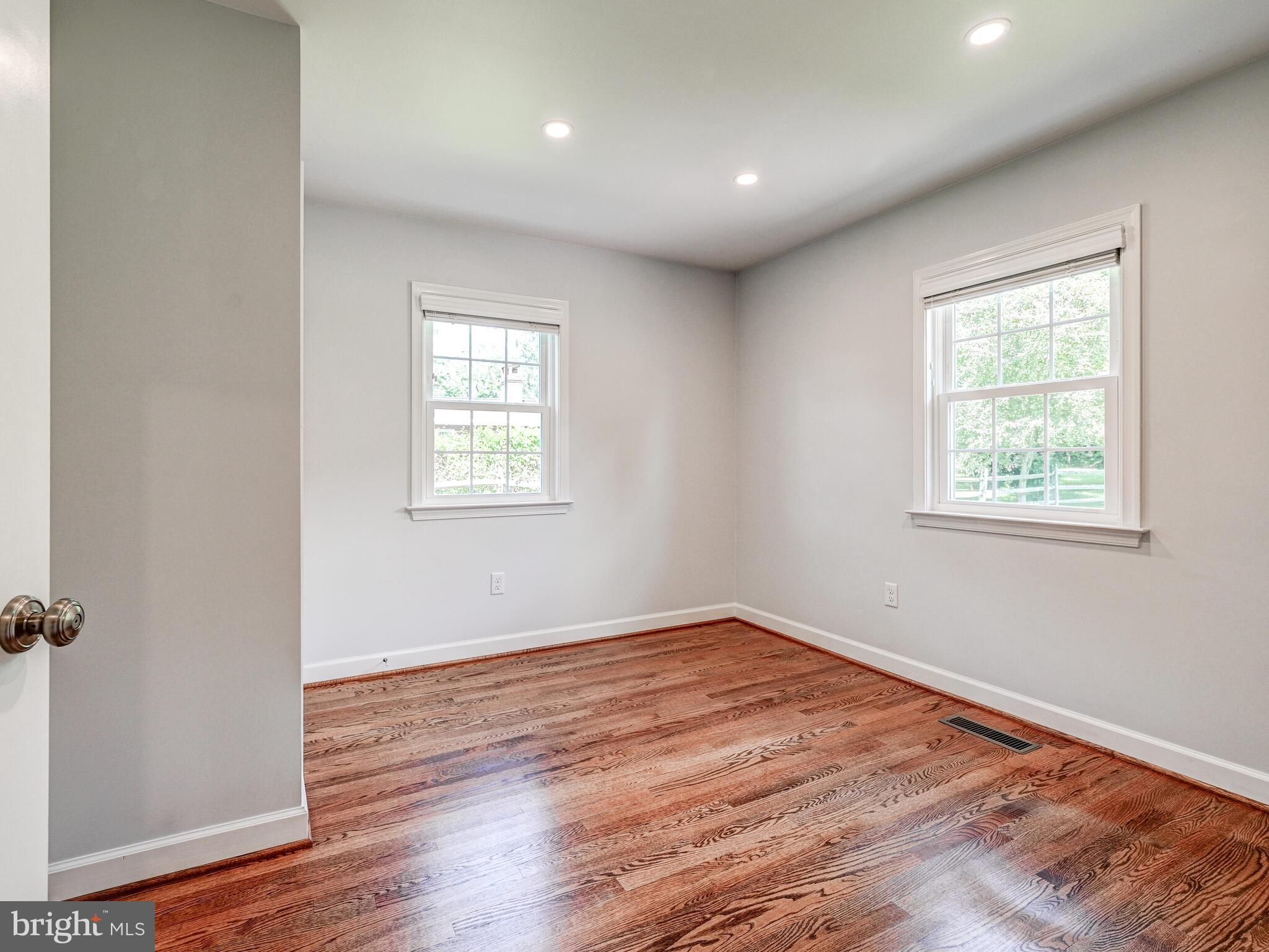 3322 Hess Road Monkton, MD 21111 - Photo 12 of 22 an empty room with wooden floor and windows