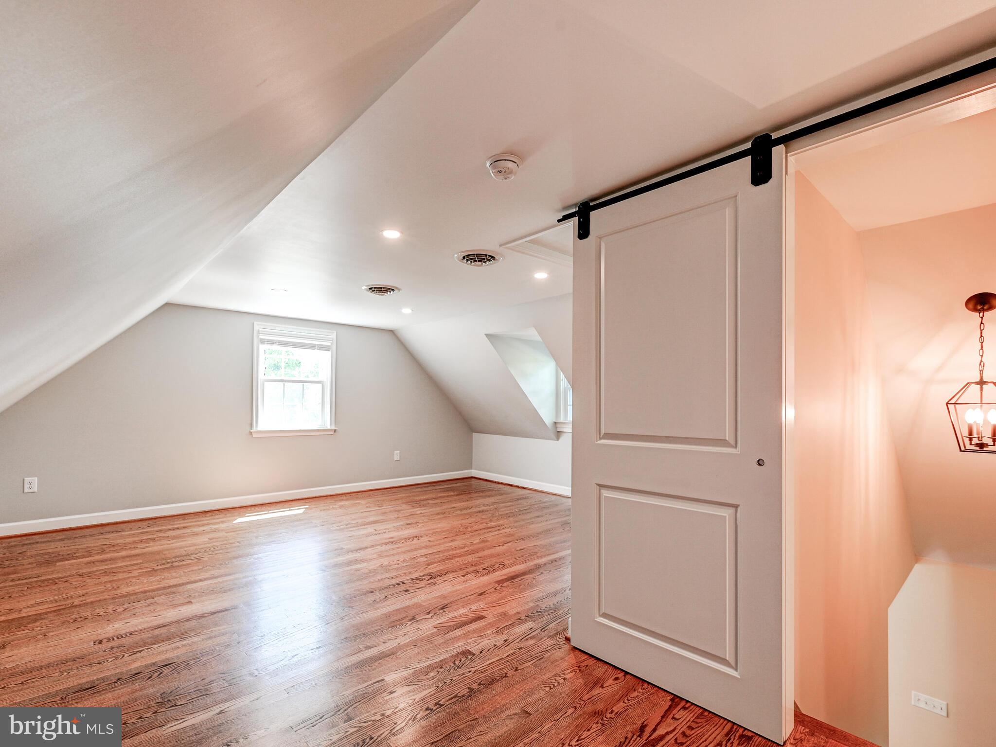 3322 Hess Road Monkton, MD 21111 - Photo 14 of 22 a view of a big room with wooden floor and windows