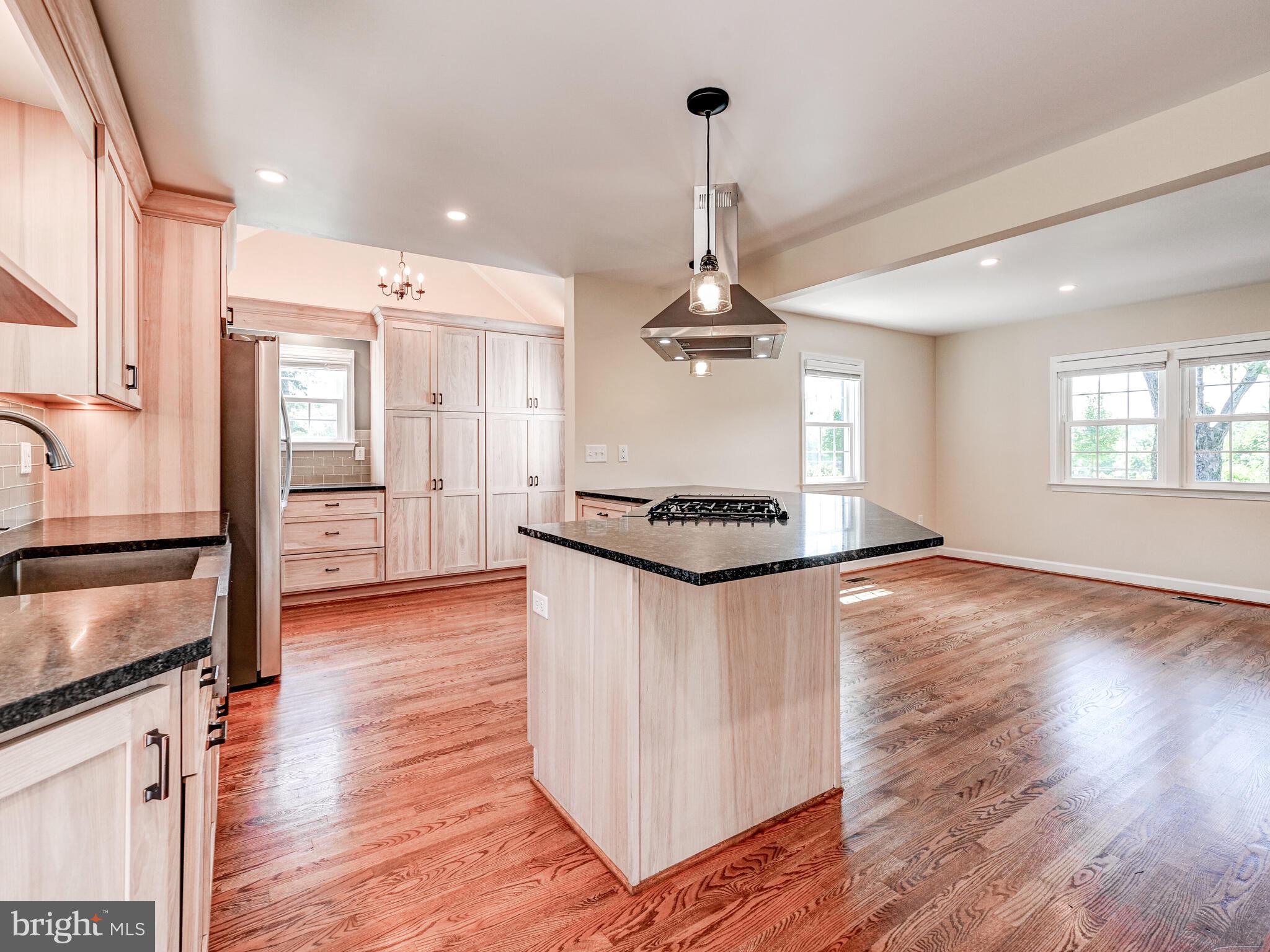 3322 Hess Road Monkton, MD 21111 - Photo 20 of 22 a kitchen with stainless steel appliances granite countertop a refrigerator a stove and a wooden floors