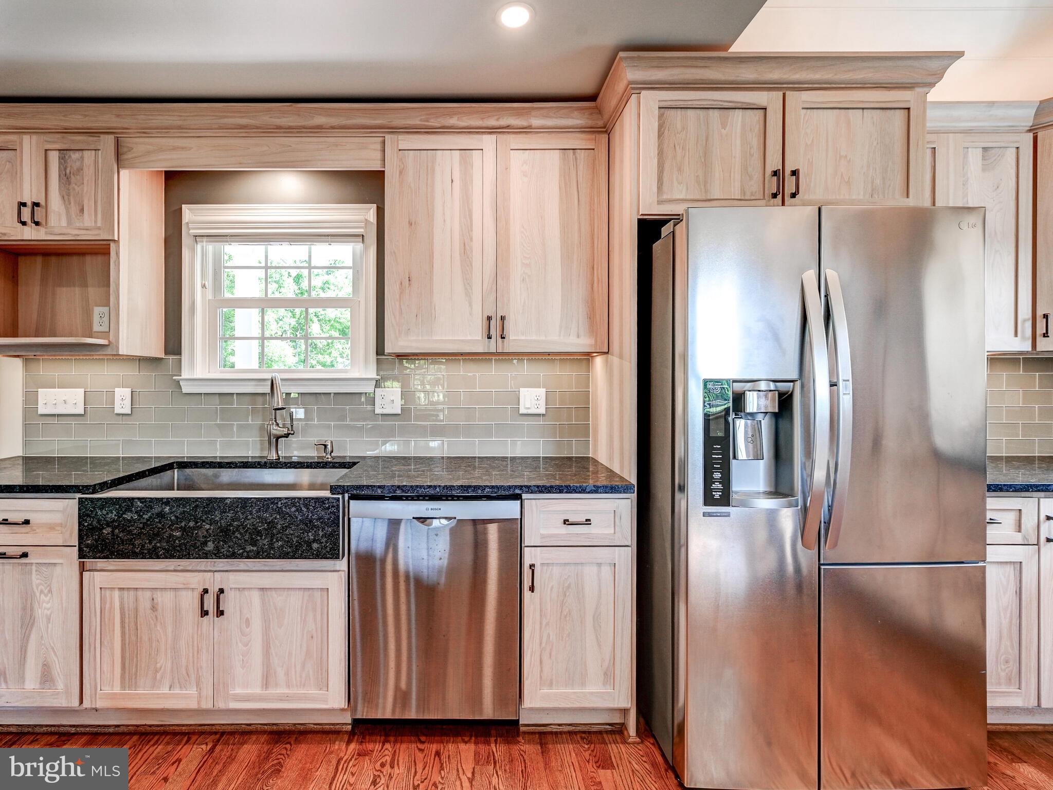 3322 Hess Road Monkton, MD 21111 - Photo 6 of 22 a kitchen with granite countertop a refrigerator and a sink