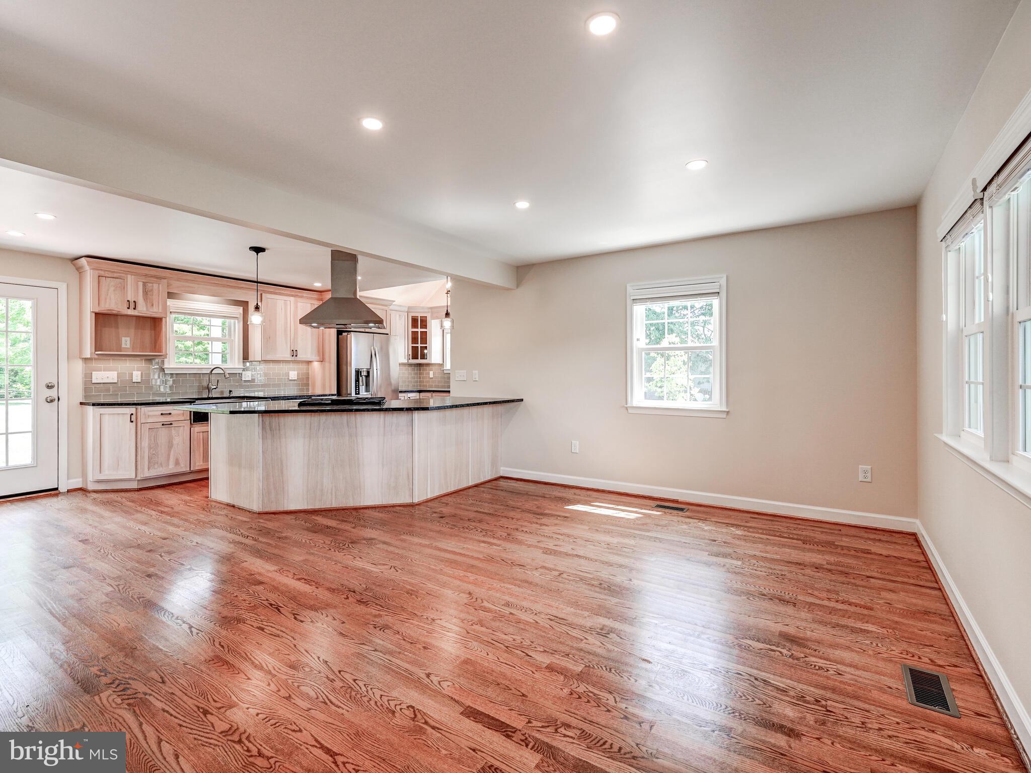 3322 Hess Road Monkton, MD 21111 - Photo 7 of 22 a view of a kitchen with granite countertop wooden floor stainless steel appliances and a window