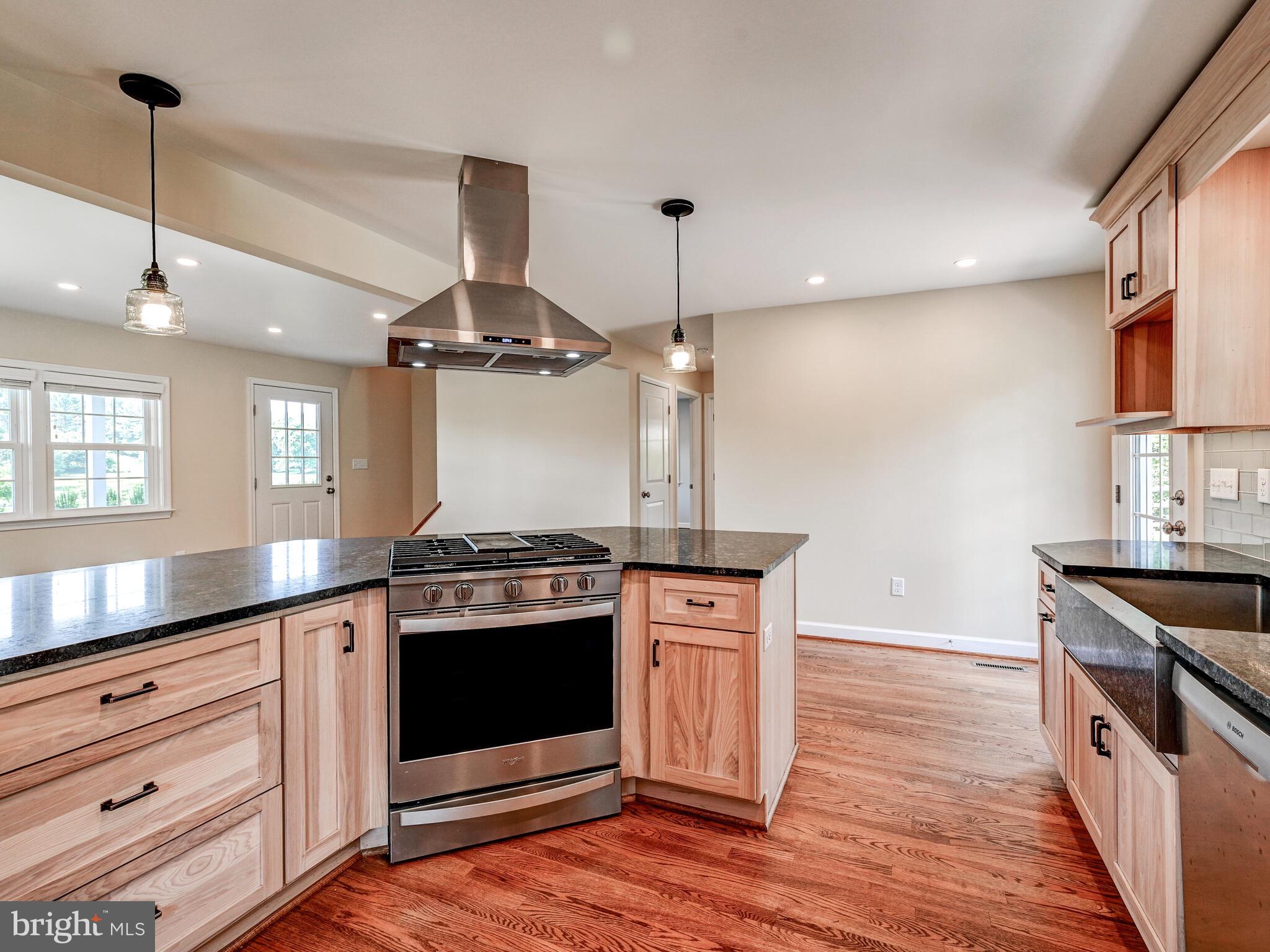 3322 Hess Road Monkton, MD 21111 - Photo 8 of 22 a kitchen with stainless steel appliances a stove and a wooden floor