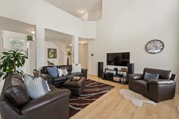 a bedroom with two beds and a flat screen tv