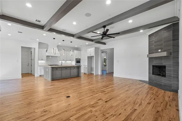 a view of kitchen with a sink and refrigerator