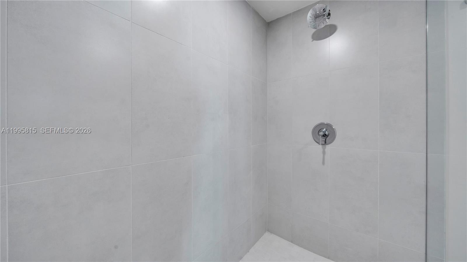 555 Northeast 34th Street, Unit 204 Miami, FL 33137 - Photo 22 of 31 a close view of shower tap