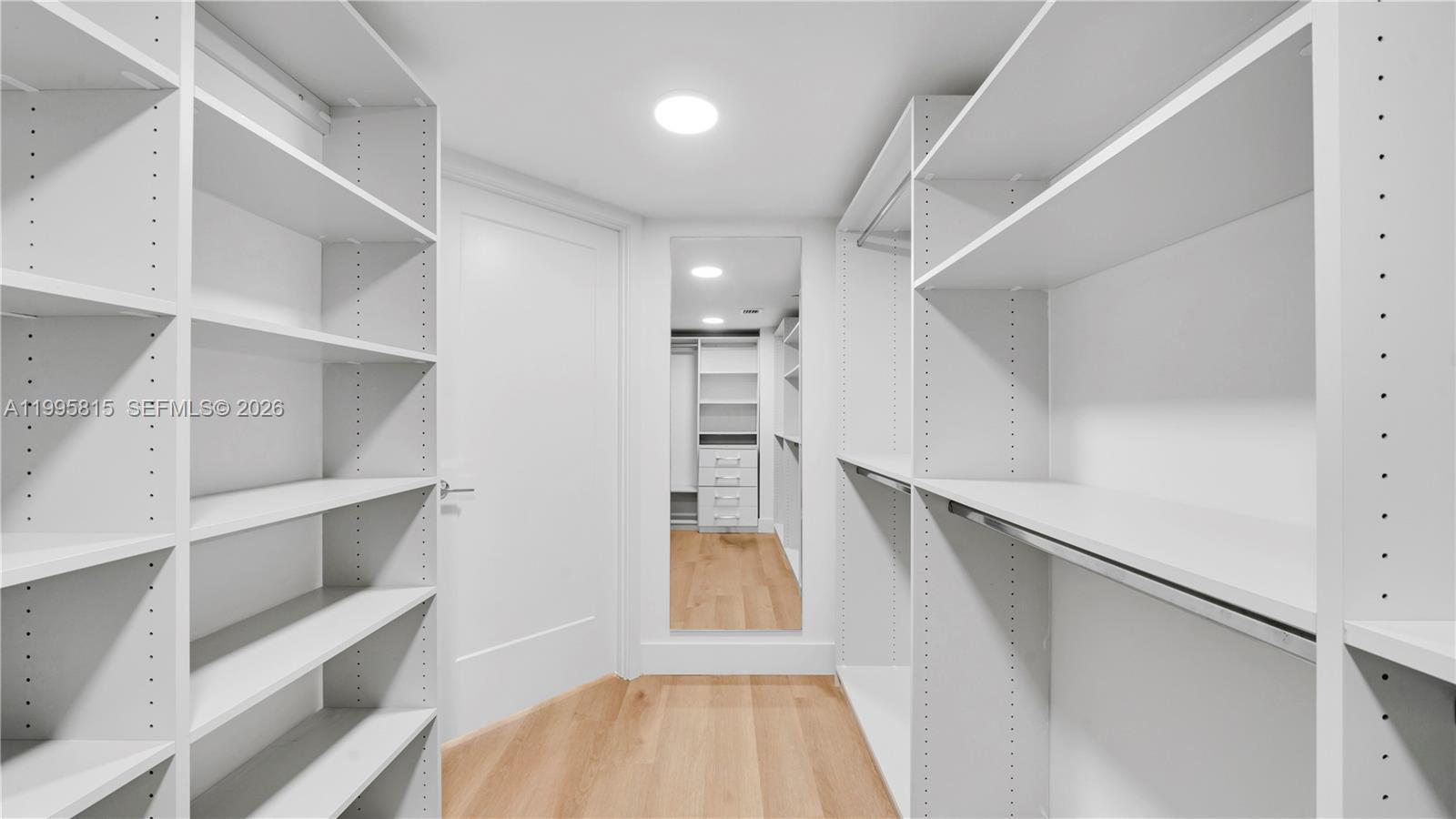 555 Northeast 34th Street, Unit 204 Miami, FL 33137 - Photo 24 of 31 a view of walk in closet with empty racks