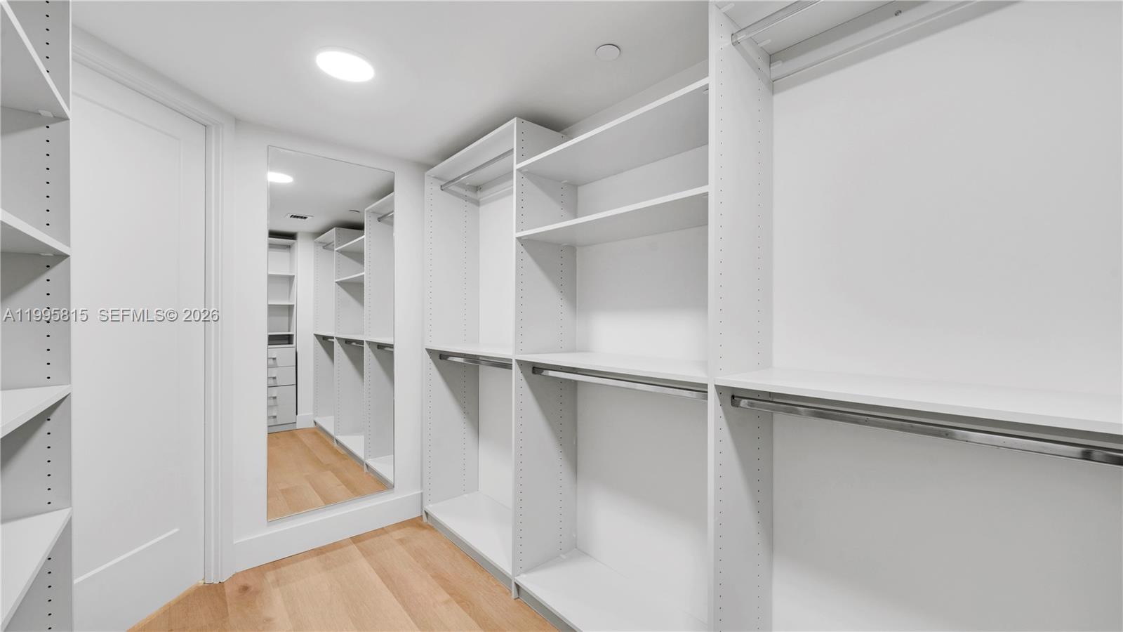 555 Northeast 34th Street, Unit 204 Miami, FL 33137 - Photo 25 of 31 a view of walk in closet with empty racks
