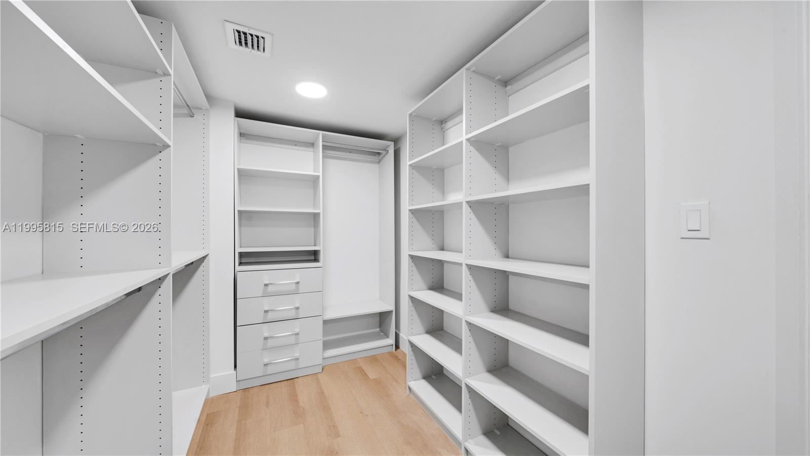 555 Northeast 34th Street, Unit 204 Miami, FL 33137 - Photo 26 of 31 a view of an empty walk in closet