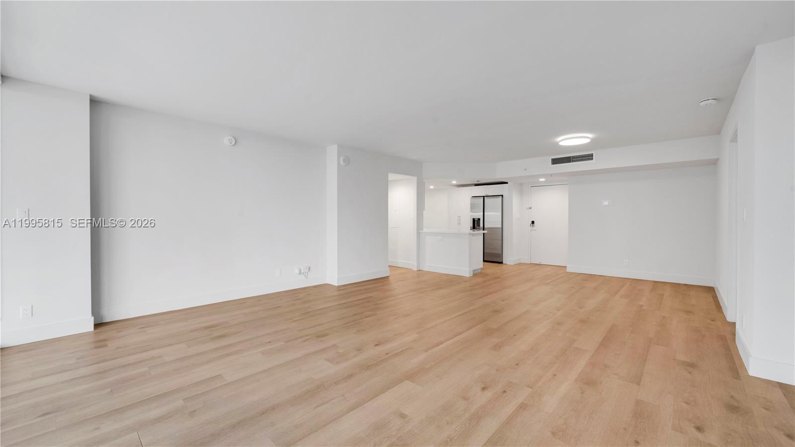 555 Northeast 34th Street, Unit 204 Miami, FL 33137 - Photo 6 of 31 a view of empty room with wooden floor
