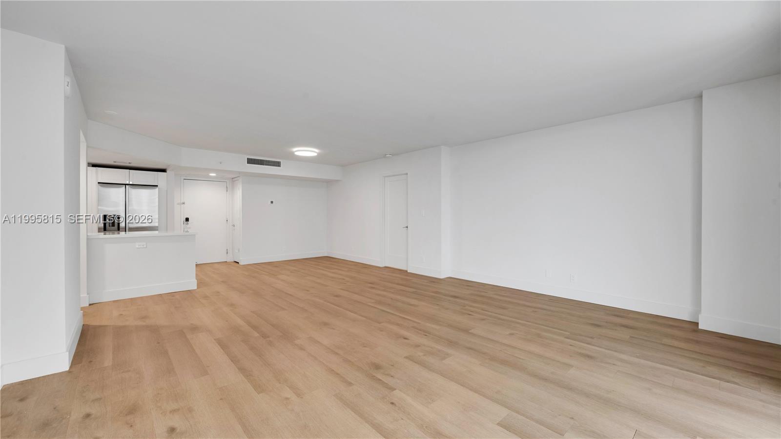 555 Northeast 34th Street, Unit 204 Miami, FL 33137 - Photo 7 of 31 a view of empty room with wooden floor
