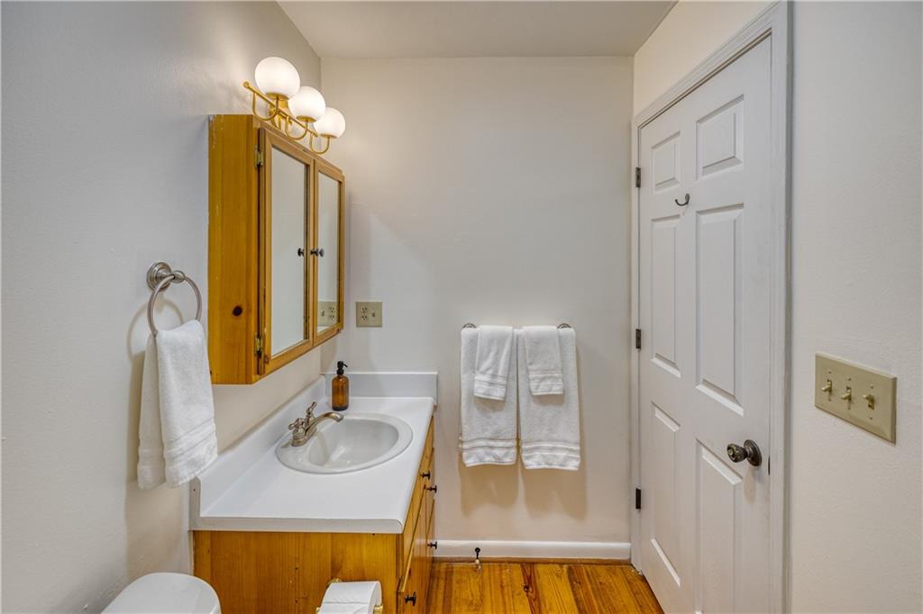 357 Mystic Lane Blue Ridge, GA 30513 - Photo 21 of 58 a bathroom with a sink a mirror and a shower