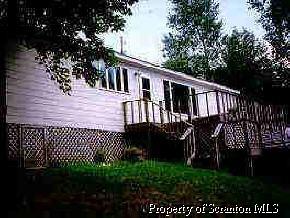 2122 Card Lake Nicholson, PA 18446 - Photo 1 of 1 a view of a house with a wooden fence