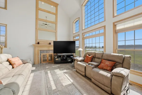 a kitchen with stainless steel appliances granite countertop a stove a sink dishwasher and a refrigerator