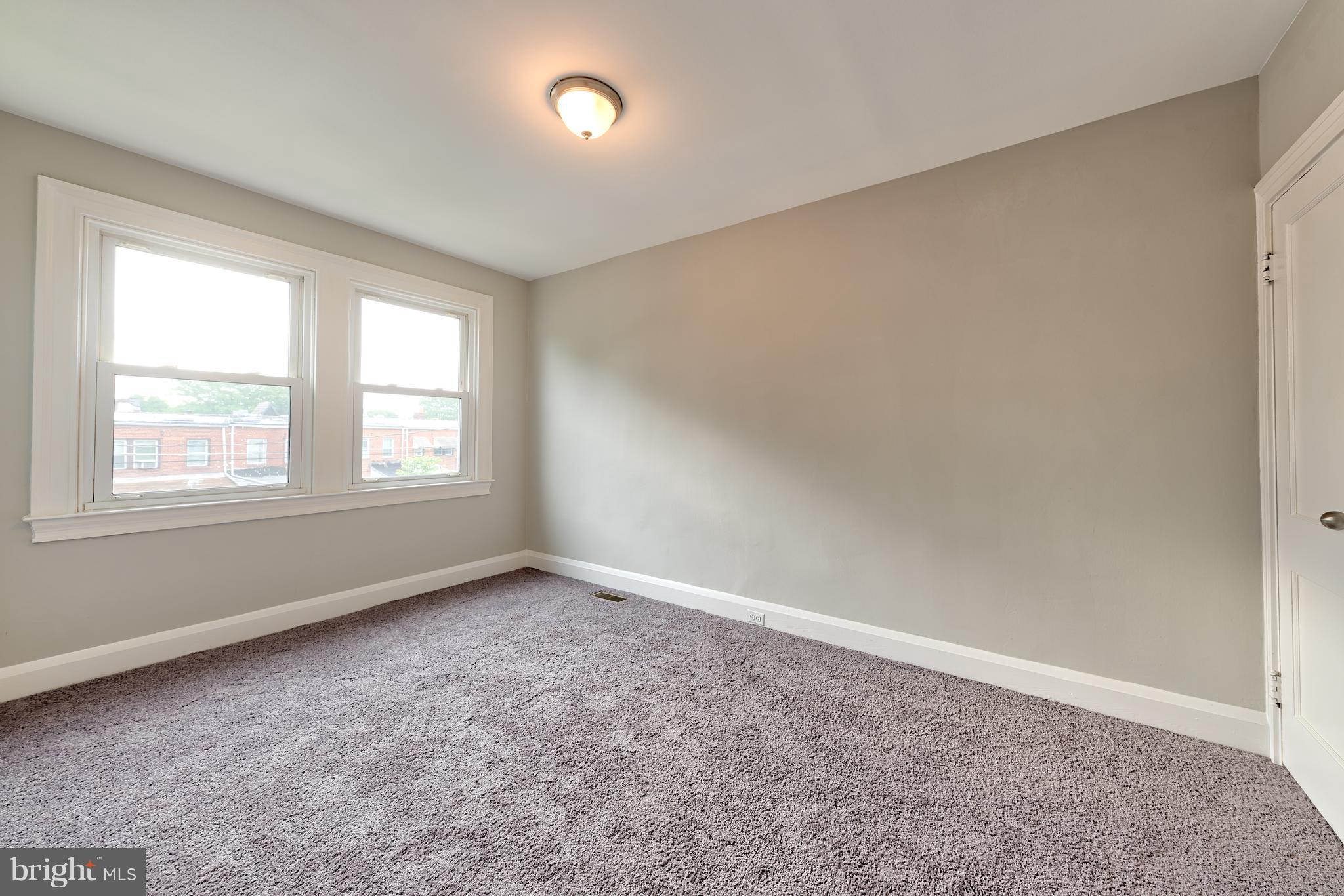 99 Willow Spring Road Baltimore, MD 21222 - Photo 22 of 30 an empty room with windows